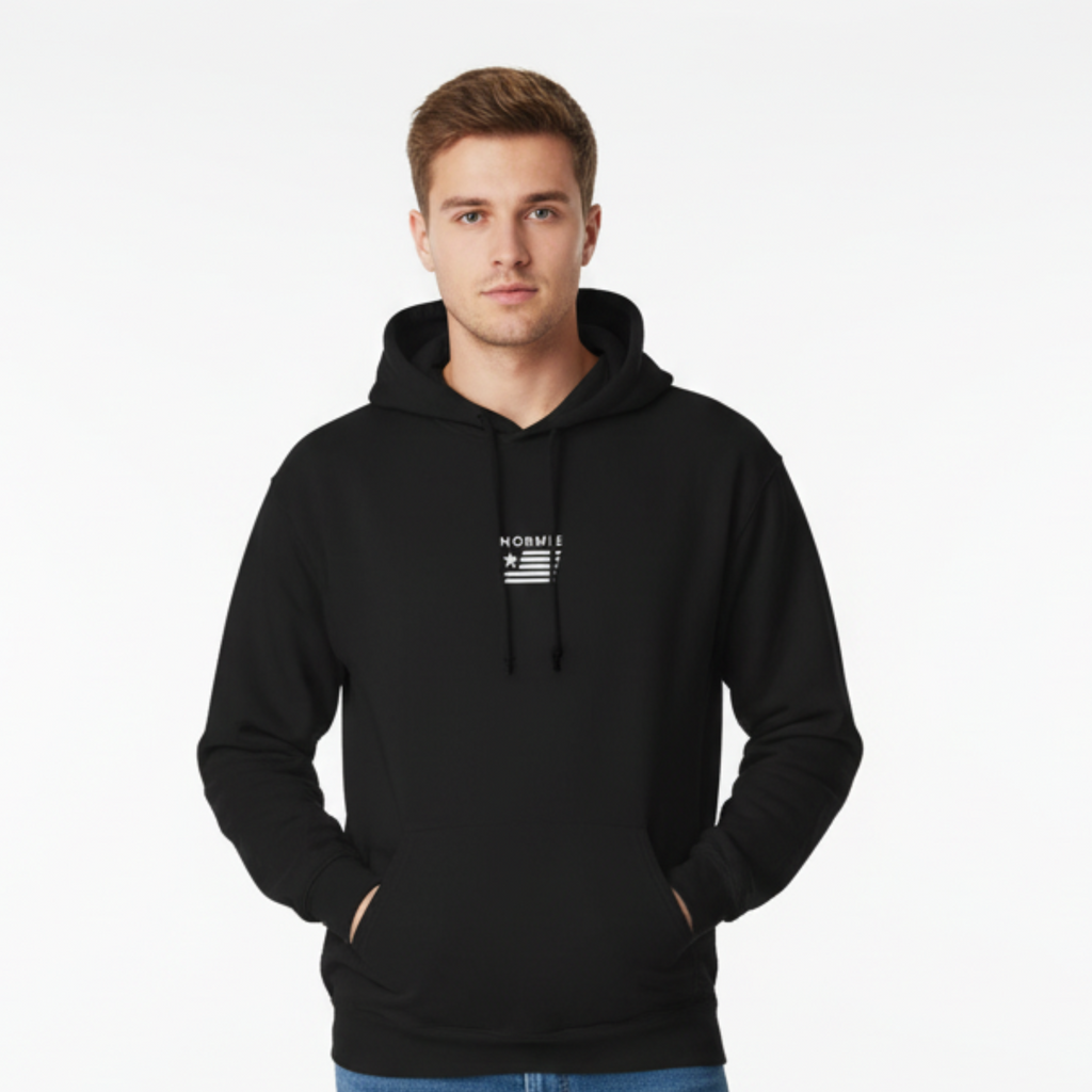 Male model in classic black hoodie with Normie logo centered on chest