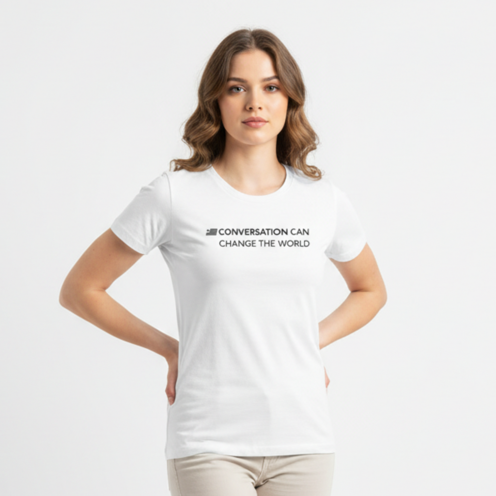 Woman wearing a white t-shirt with text on a plain background