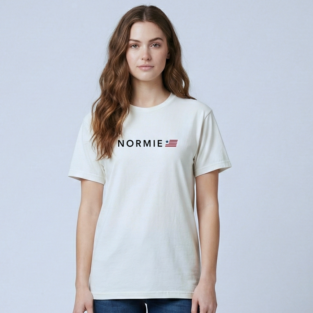 Woman wearing a white t-shirt with 'NORMIE' logo on a light gray background